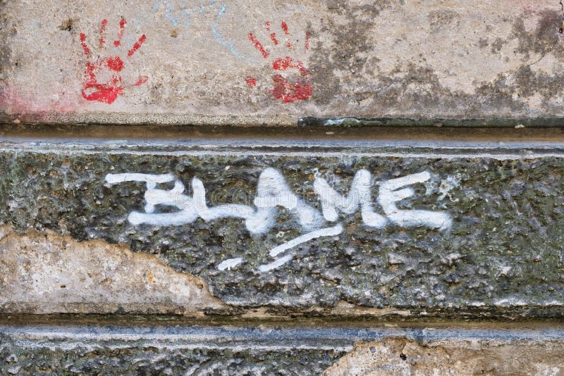 Blame Graffiti on Old Stone Wall