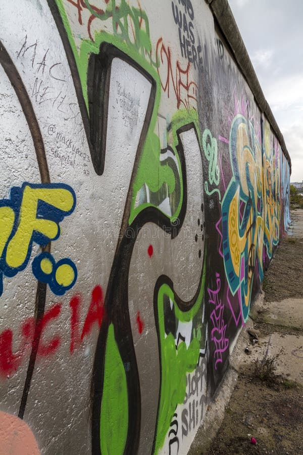 Graffiti Painting on the Berlin Wall at the East Side Gallery Editorial