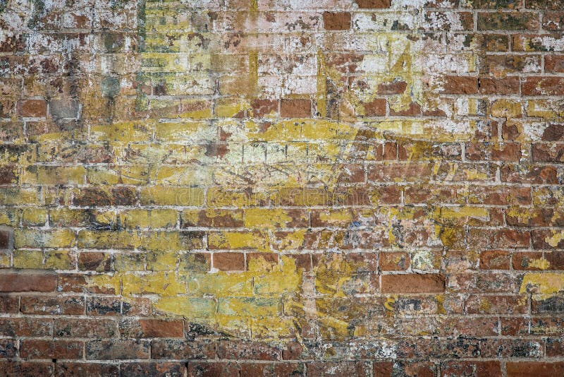 Background texture of a grunge brick wall with graffiti remains. Background texture of a grunge brick wall with graffiti remains