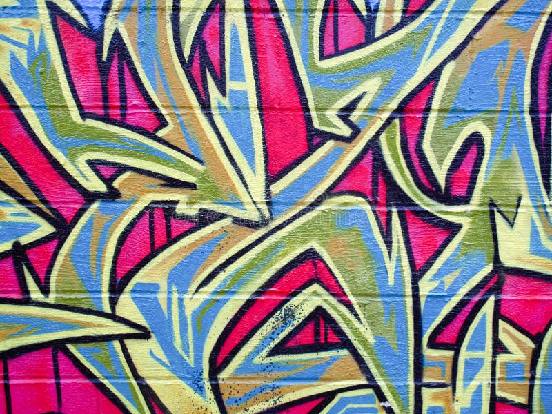 Grafiti numa parede de tijolos imagens de stock