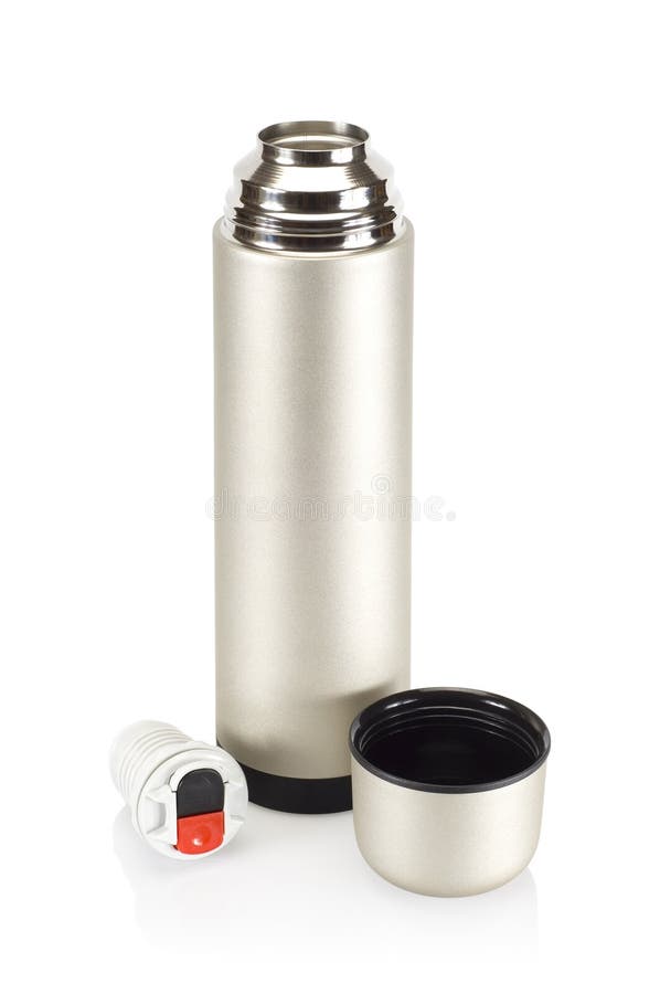 Steel Thermos With A Cup Of Hot Tee Standing On Old Stump In