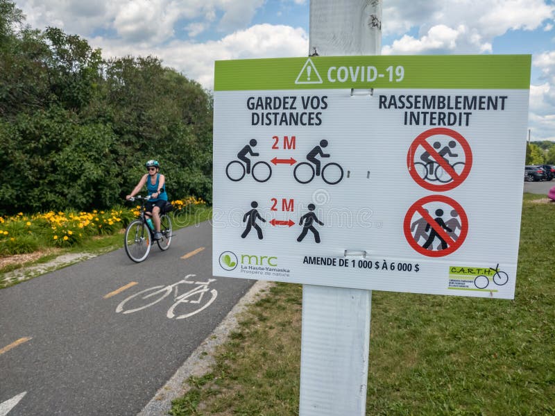 Gramby, Canada - 6 July 2020: Covid-19 guidelines for cyclists on bicycle trail