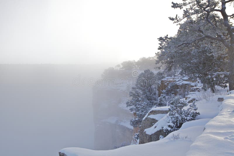 The amazing colorful scenery of the grand canyon's south rim covered in snow in winter. The amazing colorful scenery of the grand canyon's south rim covered in snow in winter