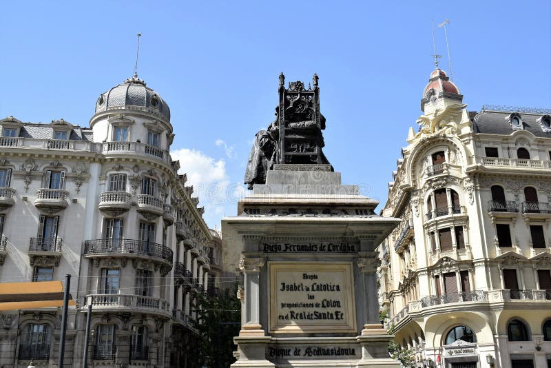 Granada great historic city of Spain-Andalusia, Old Town. Statue the Queen Isabel La Catolica and splendid corners buildings.