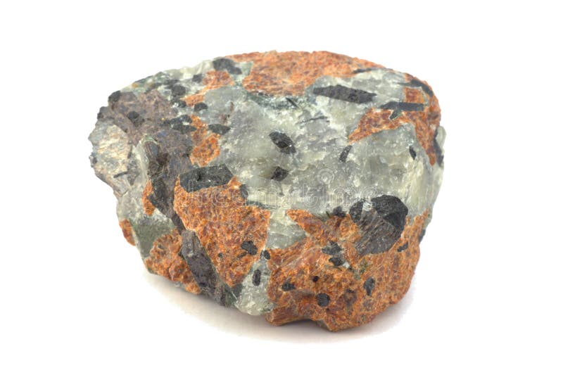 Stone with quartz and garnet inclusions. Stone with quartz and garnet inclusions
