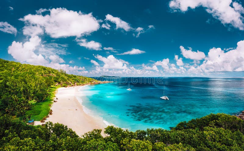 Grand Anse beach at La Digue island in Seychelles arial panoramic view. White sandy beach with blue ocean lagoon and