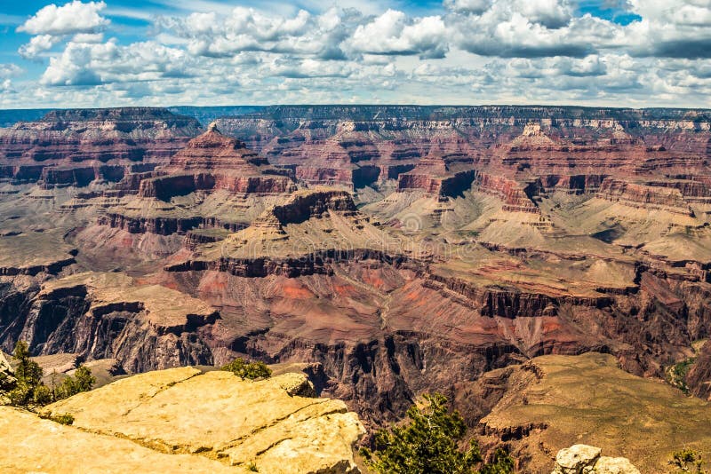 Wonderful and amazing Grand Canyon in the United States with its surrealistic shape covered with sunset light. High Definition Range colors of canyon and mountain shapes. Wonderful and amazing Grand Canyon in the United States with its surrealistic shape covered with sunset light. High Definition Range colors of canyon and mountain shapes.