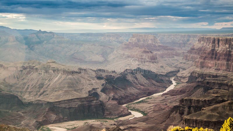 Wonderful and amazing Grand Canyon in the United States with its surrealistic shape covered with sunset light. High Definition Range colors of canyon and mountain shapes. Wonderful and amazing Grand Canyon in the United States with its surrealistic shape covered with sunset light. High Definition Range colors of canyon and mountain shapes.