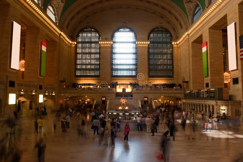 Grand Central Station. Time lapse photo of blurred people walking through Grand Central Terminal train station in New York City with one recognizable woman royalty free stock photo Grand Central Station. Time lapse photo of blurred people walking through Grand Central Terminal train station in New York City with one recognizable woman royalty free stock photo