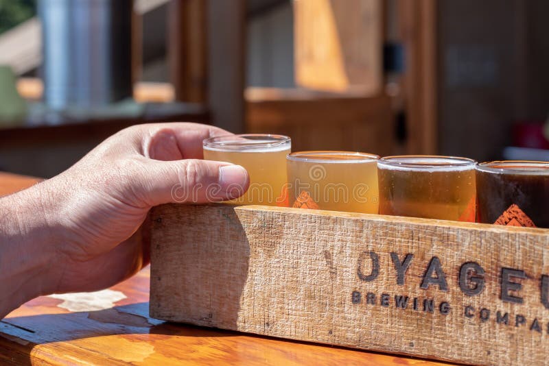 Grand Marais, MN/USA - 08-24-2019:  Stopping for a craft beer flight at a local brewery after a day of hiking. Grand Marais, MN/USA - 08-24-2019:  Stopping for a craft beer flight at a local brewery after a day of hiking