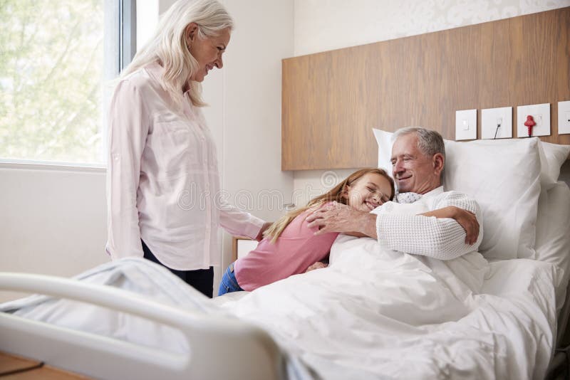 hospital room with patient and family