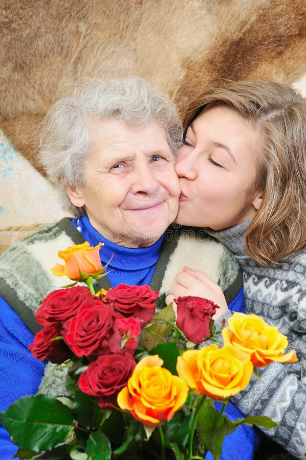 Granddaughter kissed grandmother