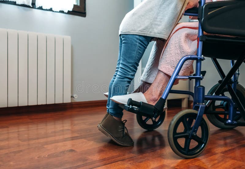 Granddaughter visiting her grandmother in wheelchair royalty free stock photography Granddaughter visiting her grandmother in wheelchair royalty free stock photography