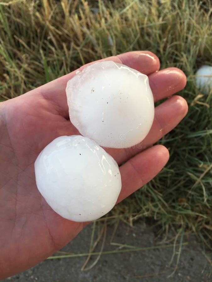 Large hail and hand. Large hail and hand