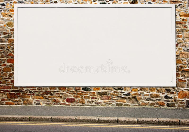 Large white blank billboard on a colorful stone wall. Large white blank billboard on a colorful stone wall.