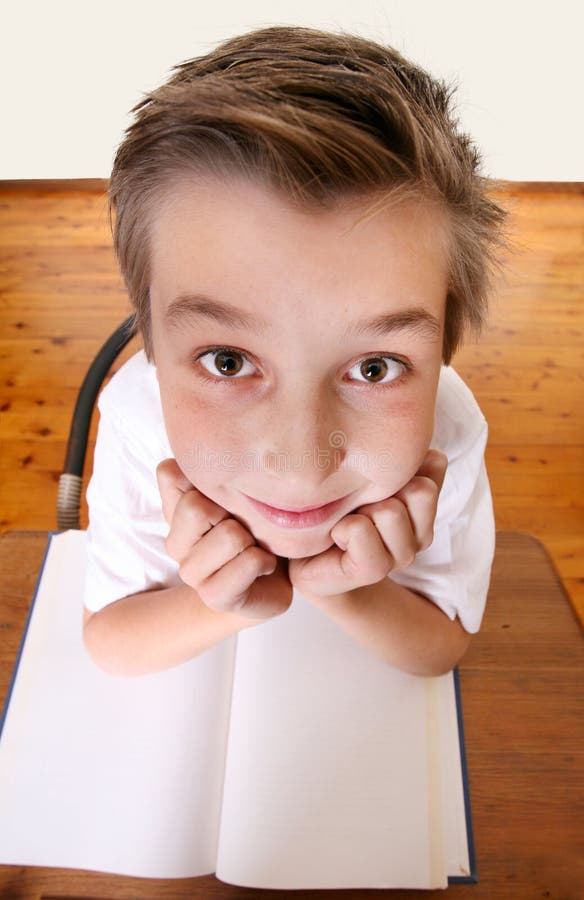 Comical geeky schoolboy with exaggerated head looking up. Focus to face only. Comical geeky schoolboy with exaggerated head looking up. Focus to face only.