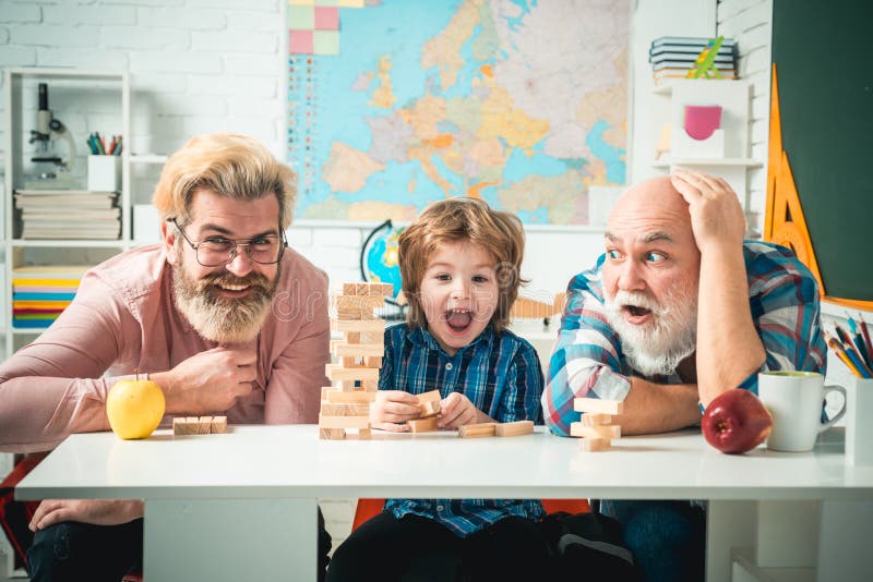 Grandfather Father And Son Playing Indoors Grandfather Father And Son