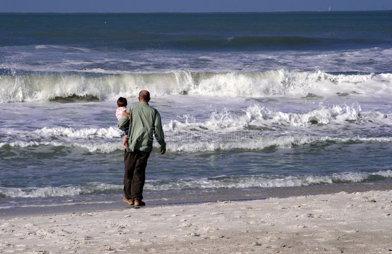 Grandfather and grandson at beach