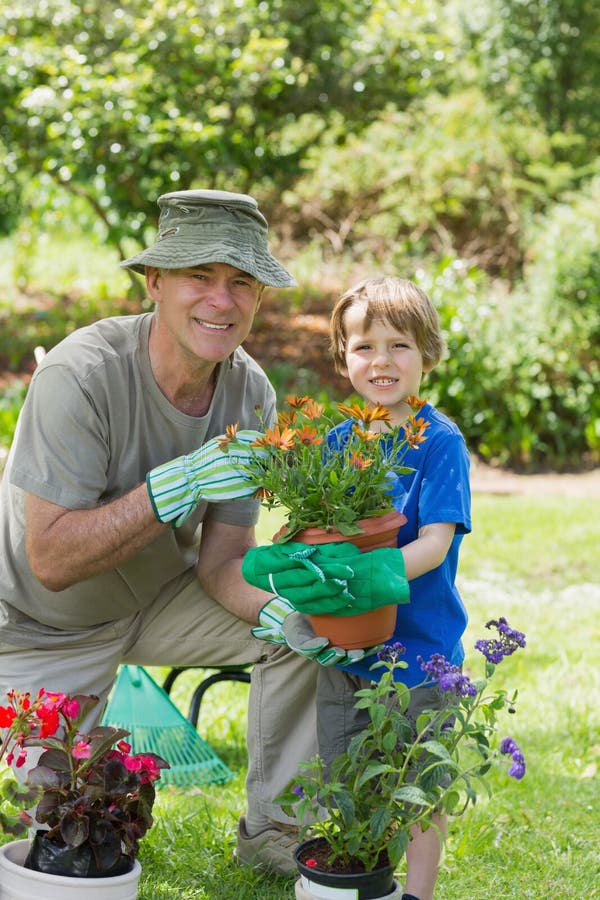 Grandfather and grandson engaged in gardening royalty free stock photography Grandfather and grandson engaged in gardening royalty free stock photography