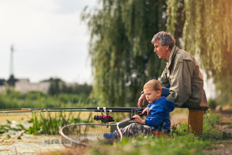 Grandfather with a grandson on feshwater fishing. royalty free stock images Grandfather with a grandson on feshwater fishing. royalty free stock images