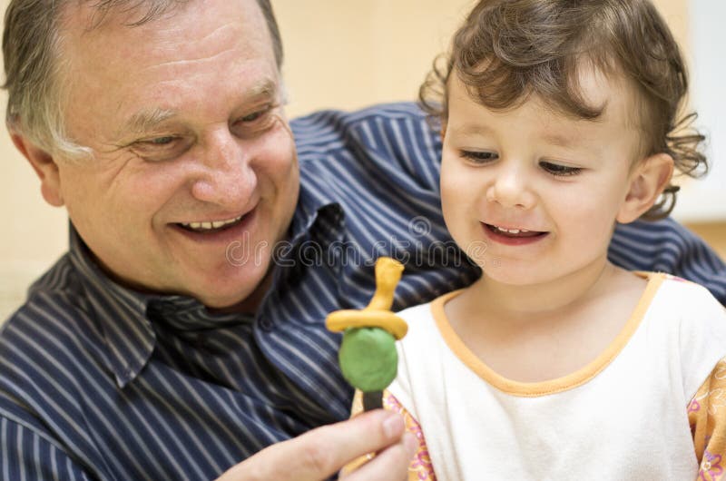 Grandfather playing with granddaughter