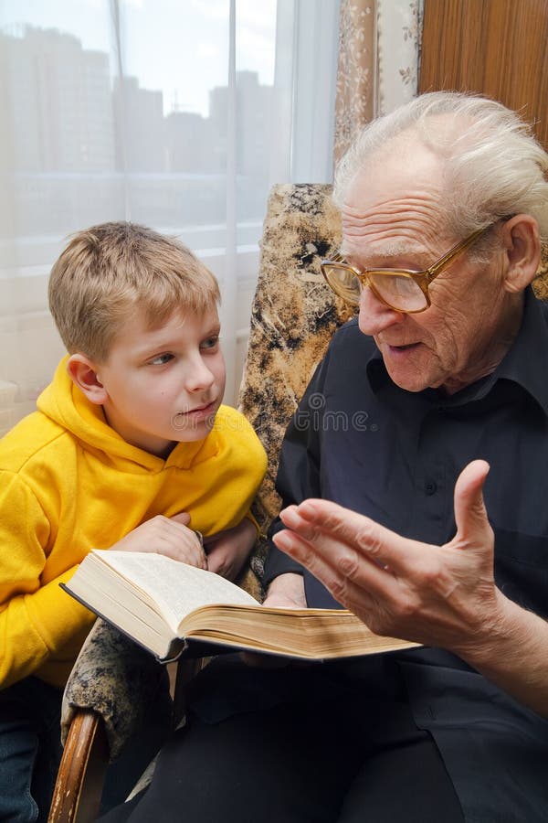 Grandfather Reading To His Grandson