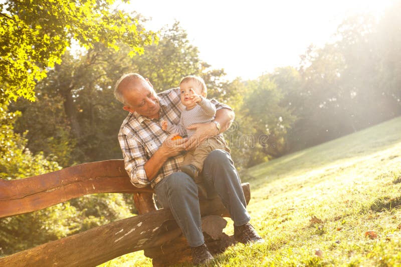 Grandfather spending time with his grandson stock images Grandfather spending time with his grandson stock images