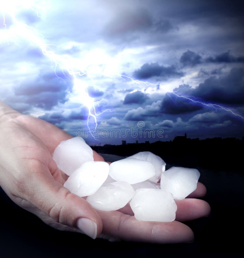 Weather anomaly hail in hands and lightning. Weather anomaly hail in hands and lightning