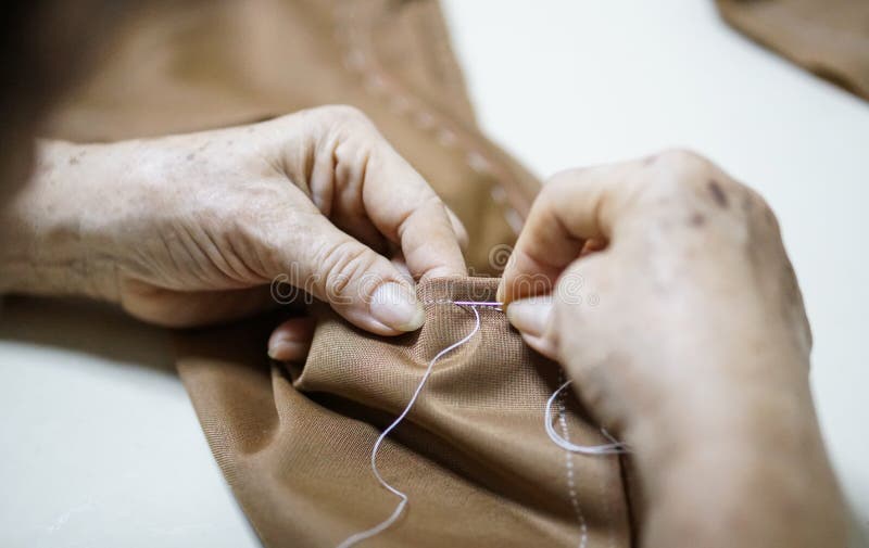 Grandma Hand Needle and Sewing Making Cloth Stock Image - Image of ...