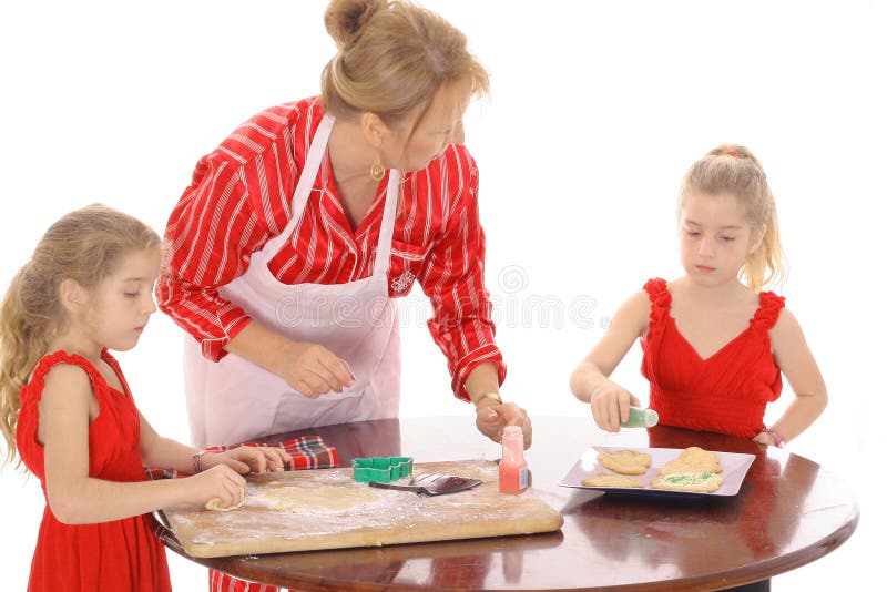 Grandmother baking cookies with children