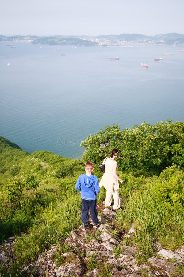 Grandmother and Grandson Come Down from the Mountain. Stock Image