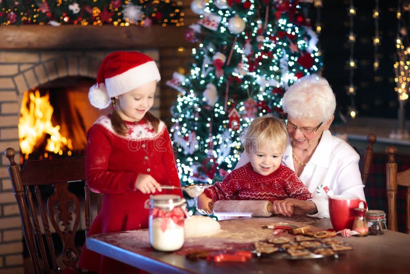 Grandmother and kids bake Christmas cookies. stock images Grandmother and kids bake Christmas cookies. stock images