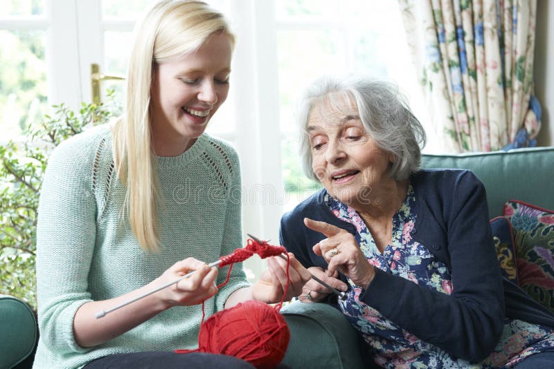 Grandmother Showing Granddaughter How To Knit stock photos Grandmother Showing Granddaughter How To Knit stock photos