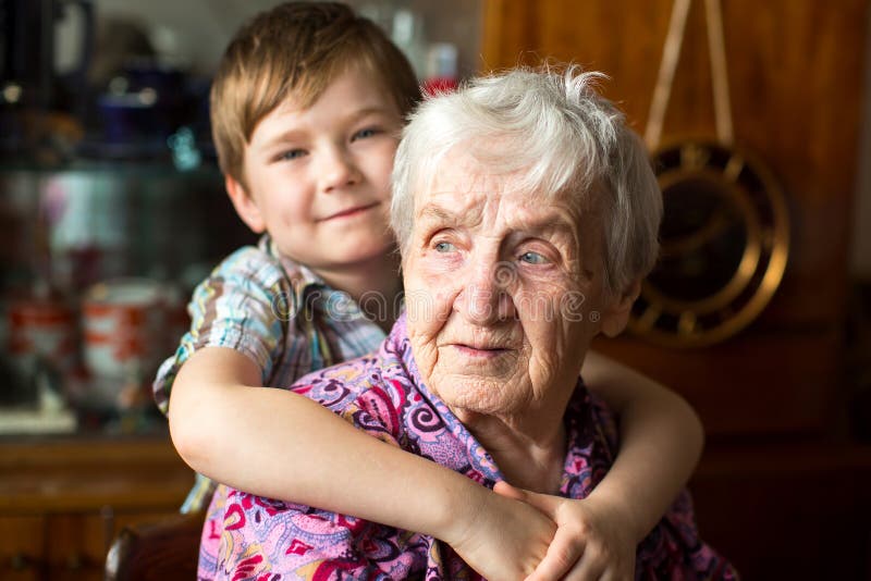 Grandmother with a small boy grandson. Love. royalty free stock image