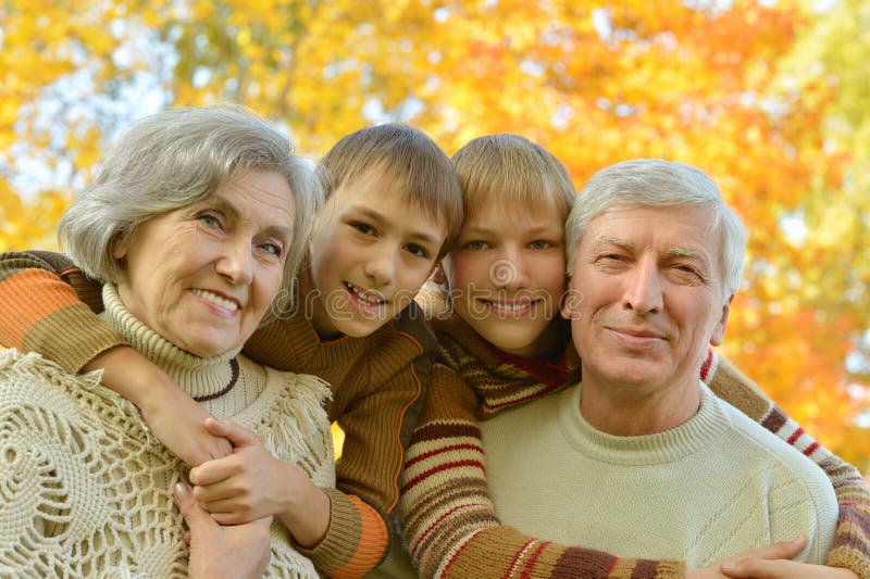 Grandparents with children in park