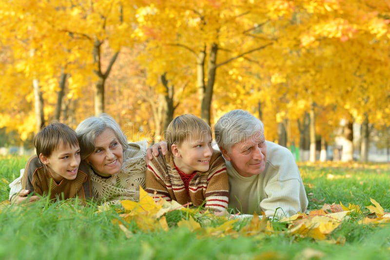 Grandparents with children in park