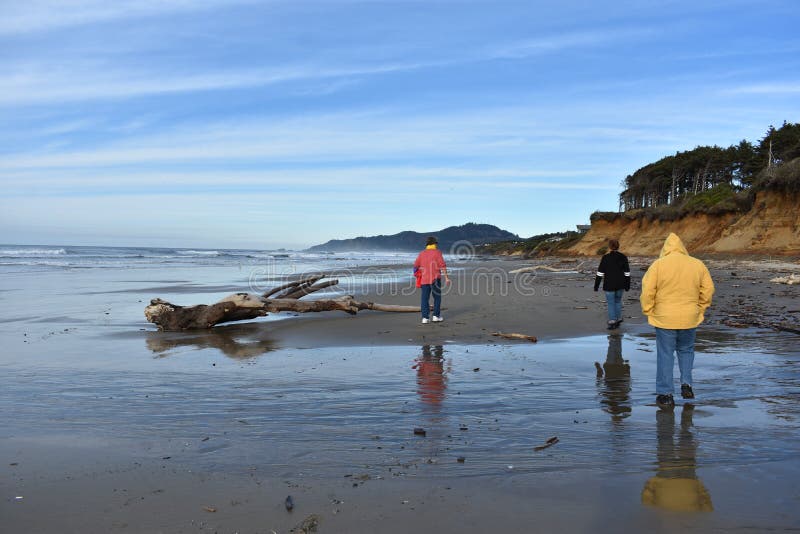 Grandparents Walking the Beach with a Grandchild royalty free stock photography Grandparents Walking the Beach with a Grandchild royalty free stock photography