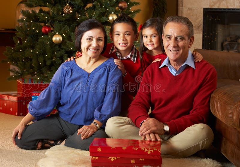 Grandparents with Grandchildren by Christmas Tree Stock Image - Image