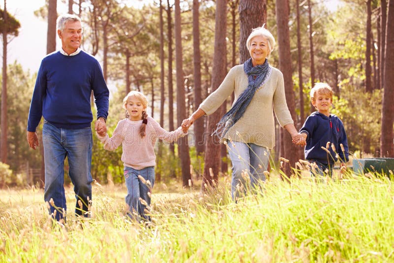 Grandparents and grandchildren walking in the countryside