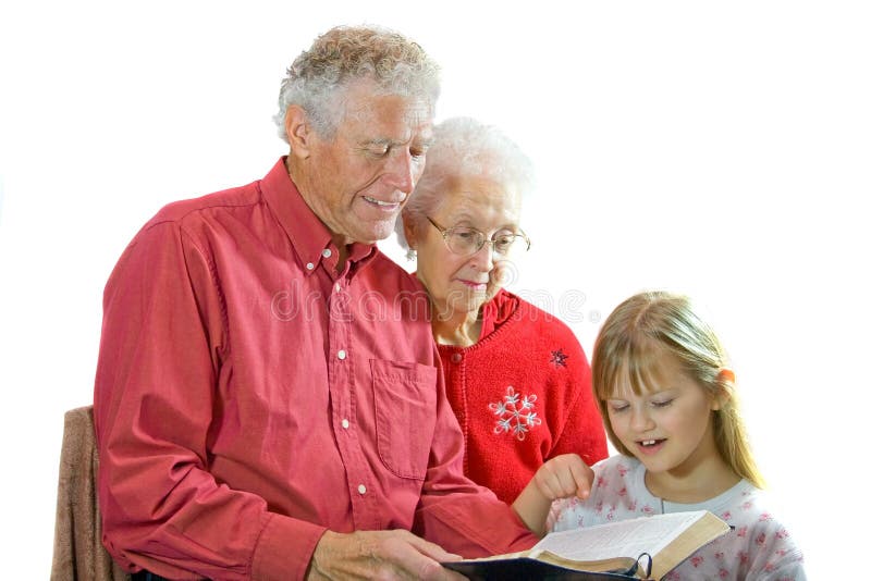 Grandparents reading to grandchild. royalty free stock image Grandparents reading to grandchild. royalty free stock image