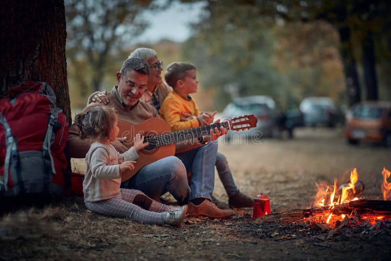 Grandparents singing with grandchildren; Quality family time concept