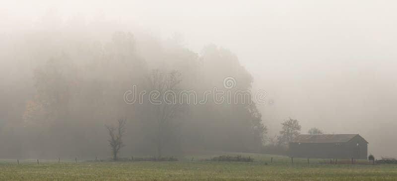 A foggy autumn morning in Cades Cove, a valley of the Smoky Mountains Nat. Park, USA. Stitched panorama. A foggy autumn morning in Cades Cove, a valley of the Smoky Mountains Nat. Park, USA. Stitched panorama.