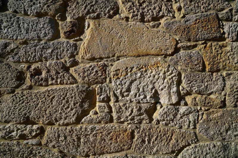 Granite stone bush hammered masonry wall in Galicia Spain. Granite stone bush hammered masonry wall in Galicia Spain