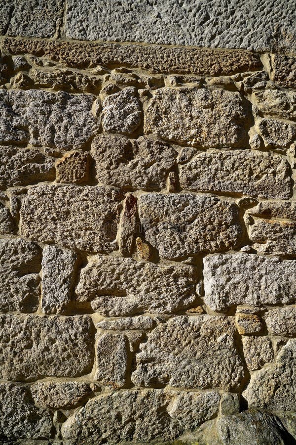 Granite stone bush hammered masonry wall in Galicia Spain. Granite stone bush hammered masonry wall in Galicia Spain