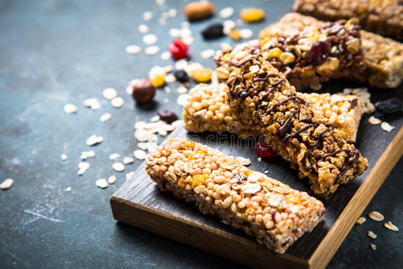 Granola Bar with Nuts, Fruit and Berries on Black. Stock Photo Image
