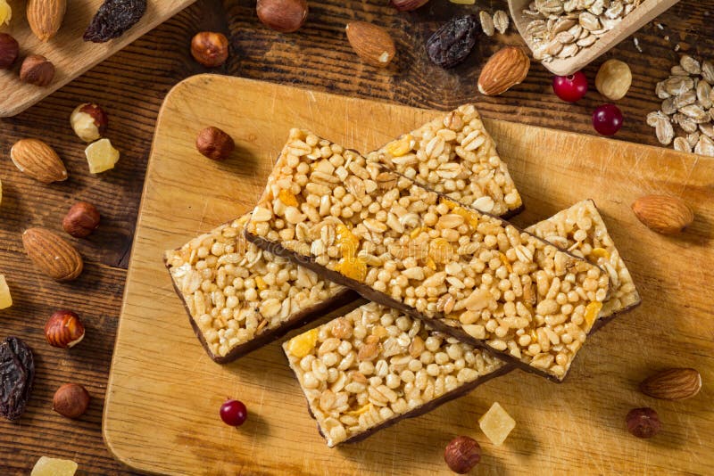 Granola bars / muesli bars on wooden cutting board stock images Granola bars / muesli bars on wooden cutting board stock images