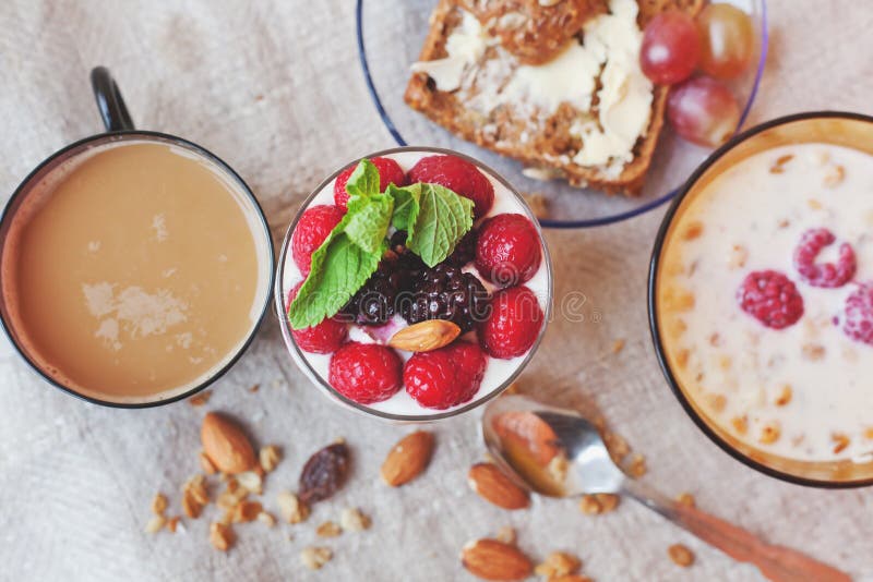 Granola with Cream and Fresh Berries and Cup of Coffee, Typical Stock