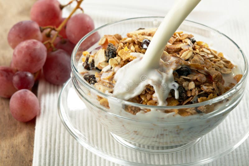 Granola and milk splash stock image. Image of glass, organic 21918921