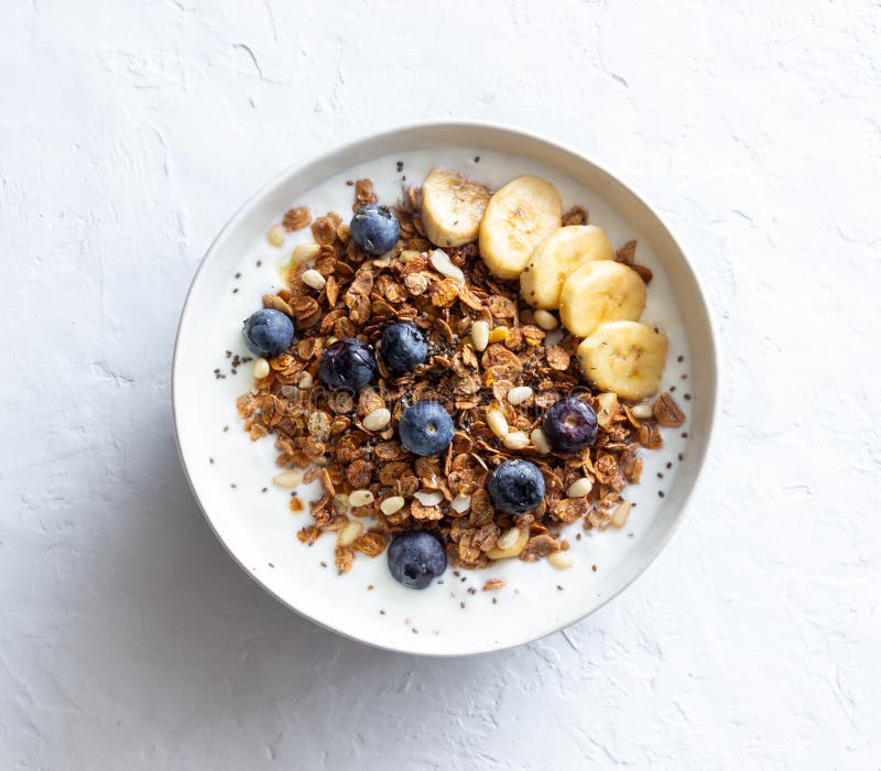 Granola with Yogurt, Blueberries, Nuts, Banana and Honey. Muesli ...