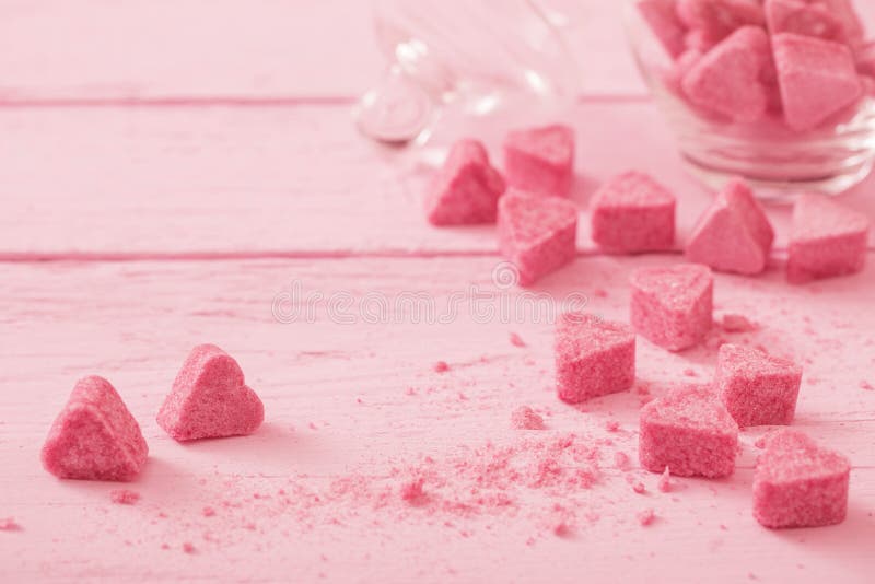 Granulated pink sugar in the shape of heart. 